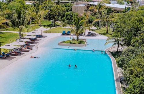 Paje Condo | 24/7 power 1-bedroom condo with on-site pool. Short 500meters walk to Paje Beach