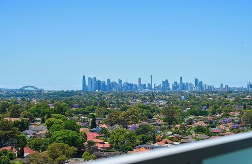 Burwood Apartment | KozyGuru | Burwood | City Skyline – Steps to Train
