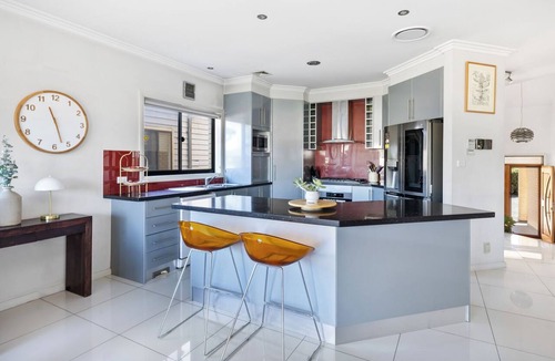 Rhodes House | Modern Rhodes Family Home with BBQ, Balcony & Two Living Areas