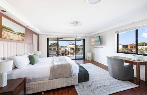 Rhodes House | Modern Rhodes Family Home with BBQ, Balcony & Two Living Areas
