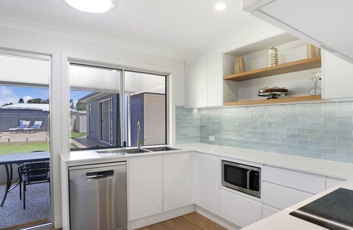 Berkeley Vale House | Poolside Family Retreat by HolidayCo.
