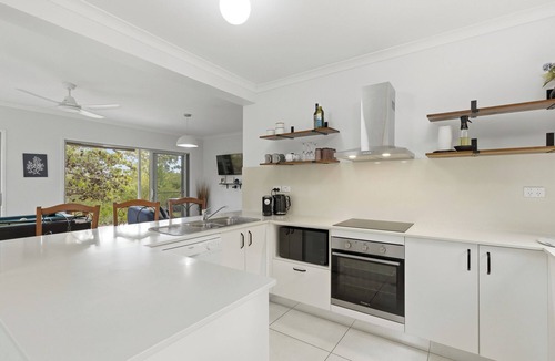 Kingfisher Bay House | Waiuta Retreat Holiday House with Outdoor Theatre, Sunset and Water Views