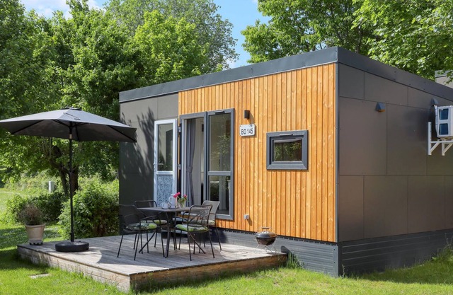 Experience a real Tiny House vacation close to nature at Camping Park Wemding! in Wemding