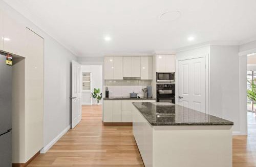 Banksia Beach House | Bribie Waterfront Retreat - Pontoon Pool & Kayaks